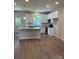 Modern kitchen featuring white cabinets, granite countertops, stainless steel appliances, and a stylish island at 242 North Ave, Troutman, NC 28166