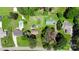 Aerial view of neighborhood highlighting the properties, pool, pond, landscaping, and mature trees at 252 Chuckwood Rd, Mooresville, NC 28117