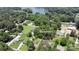 An aerial view showcasing a lake house including lake access and surrounding greenery at 252 Chuckwood Rd, Mooresville, NC 28117