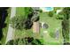 Aerial view of the property and its large backyard with a pool and wooded perimeter for privacy at 252 Chuckwood Rd, Mooresville, NC 28117