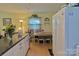 Eat-in kitchen featuring a breakfast nook, wood-look flooring, and a white refrigerator at 252 Chuckwood Rd, Mooresville, NC 28117