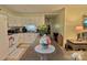 View of the kitchen with white cabinets and a granite countertop at 252 Chuckwood Rd, Mooresville, NC 28117