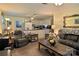 A living room with an open concept to the kitchen featuring neutral colors and carpet at 252 Chuckwood Rd, Mooresville, NC 28117