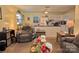 Living room featuring neutral colors, a ceiling fan and open to the kitchen at 252 Chuckwood Rd, Mooresville, NC 28117