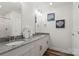 Bathroom features granite counters, modern fixtures and tiled shower at 2813 Ava Ave, Charlotte, NC 28208