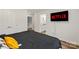 Bright bedroom shows en suite bathroom access with modern floors and decor at 2813 Ava Ave, Charlotte, NC 28208