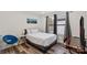 Bedroom featuring wood-look floors, a large window, and desk area at 2813 Ava Ave, Charlotte, NC 28208
