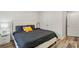 Stylish bedroom offers neutral walls, a tufted headboard and modern accents at 2813 Ava Ave, Charlotte, NC 28208