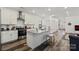 Bright kitchen featuring a center island, stainless appliances, and modern design at 2813 Ava Ave, Charlotte, NC 28208