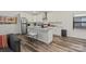 Bright kitchen with island, white cabinetry, stainless steel appliances, and modern fixtures at 2813 Ava Ave, Charlotte, NC 28208