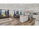 Open floorplan showcasing a modern kitchen, living area, and wood flooring at 2813 Ava Ave, Charlotte, NC 28208