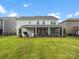 Expansive backyard featuring a covered patio, a grilling area, and ample room to enjoy the outdoors at 301 Supernova Dr, York, SC 29745