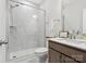 Bathroom featuring a glass-enclosed shower with marble surround and modern vanity at 301 Supernova Dr, York, SC 29745