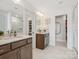 Bright bathroom showcasing double vanity sinks and walk-in closet at 301 Supernova Dr, York, SC 29745