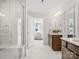 Bright bathroom featuring a modern shower, double vanity, and access to the bedroom at 301 Supernova Dr, York, SC 29745