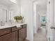 A bathroom featuring a vanity with a white countertop and a large mirror at 301 Supernova Dr, York, SC 29745