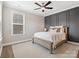 Well-lit bedroom with neutral tones, hardwood floors, and a ceiling fan at 301 Supernova Dr, York, SC 29745