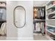 Organized walk-in closet with built-in shelving and a mirror for dressing at 301 Supernova Dr, York, SC 29745