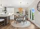 Cozy eat-in kitchen area with modern lighting, round table, and access to outdoor patio at 301 Supernova Dr, York, SC 29745