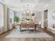 Inviting dining room with natural light, elegant lighting, and a stylish wood table at 301 Supernova Dr, York, SC 29745