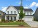 Beautiful two-story white home featuring a manicured lawn and a welcoming blue front door at 301 Supernova Dr, York, SC 29745