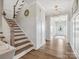 Welcoming foyer with elegant lighting, hardwood floors, and a view of the staircase at 301 Supernova Dr, York, SC 29745