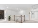 Bright upper hallway featuring white wainscoting and neutral decor at 301 Supernova Dr, York, SC 29745