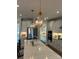 Bright kitchen with stainless steel appliances, quartz countertops, and decorative pendant lighting at 301 Supernova Dr, York, SC 29745