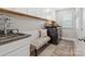 Functional laundry room with granite counters, washer, dryer, bench seat, and ample storage at 301 Supernova Dr, York, SC 29745