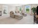 A stylish living room featuring comfortable seating, large windows, and a serene atmosphere at 301 Supernova Dr, York, SC 29745