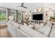 Bright living room with built-in shelves, a ceiling fan, neutral colors, and hardwood floors at 301 Supernova Dr, York, SC 29745