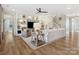 Open-concept living room with built-in shelving, hardwood floors, and abundant natural light at 301 Supernova Dr, York, SC 29745