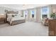 Spacious main bedroom with ample natural light, carpeted floors, and designer finishes at 301 Supernova Dr, York, SC 29745