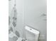 Modern bathroom features a gray and white tiled shower and white toilet at 3109 Morson St, Charlotte, NC 28208