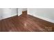 Bedroom featuring beautiful hardwood floors and neutral colored walls for a comforting aesthetic at 3109 Morson St, Charlotte, NC 28208
