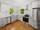 Beautiful kitchen features stainless steel appliances, white cabinets and subway tile backsplash at 3109 Morson St, Charlotte, NC 28208