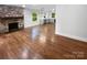 Open floorplan with hardwood flooring, stone fireplace and updated kitchen at 3109 Morson St, Charlotte, NC 28208