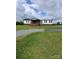 Charming home featuring a covered front porch, mature lawn, and gravel driveway at 315 S Grandview Rd, Clover, SC 29710