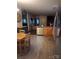 Open kitchen layout with stainless steel dishwasher and wood table and chairs at 315 S Grandview Rd, Clover, SC 29710