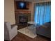 Cozy living room featuring a stone fireplace, and a flat-screen TV at 315 S Grandview Rd, Clover, SC 29710