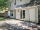 Exterior patio featuring sliding glass doors and a small shed near the home at 3313 Fortis Ln, Matthews, NC 28105