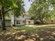 Backyard showcasing a concrete patio, a storage shed, and a wooden fence, offering a private outdoor space at 3313 Fortis Ln, Matthews, NC 28105