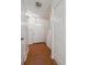 Bright foyer with hardwood-style floors, white trim, front door and closet at 3313 Fortis Ln, Matthews, NC 28105