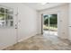 Bright kitchen area with backyard access via sliding glass door and adjacent doorway at 3313 Fortis Ln, Matthews, NC 28105