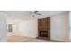 Inviting living room with neutral walls, carpet, a brick fireplace, a window, and a chandelier light fixture at 3313 Fortis Ln, Matthews, NC 28105
