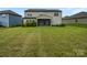 A large backyard with green grass features a screened in patio attached to the home at 3486 Duchess Ave, Fort Mill, SC 29707