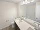 Clean bathroom features a long countertop, a large mirror, a toilet and a bathtub/shower with white tile at 3486 Duchess Ave, Fort Mill, SC 29707