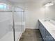 Bathroom with a glass enclosed shower, double vanity, and stylish fixtures at 3486 Duchess Ave, Fort Mill, SC 29707