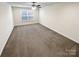 Neutral bedroom with window, ceiling fan, and carpet flooring providing a bright and clean space at 3486 Duchess Ave, Fort Mill, SC 29707