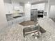 Modern kitchen featuring granite countertops, stainless steel appliances, white cabinetry, and a stylish backsplash at 3486 Duchess Ave, Fort Mill, SC 29707